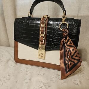 Elegant Black and Brown Handbag with Gold Accents